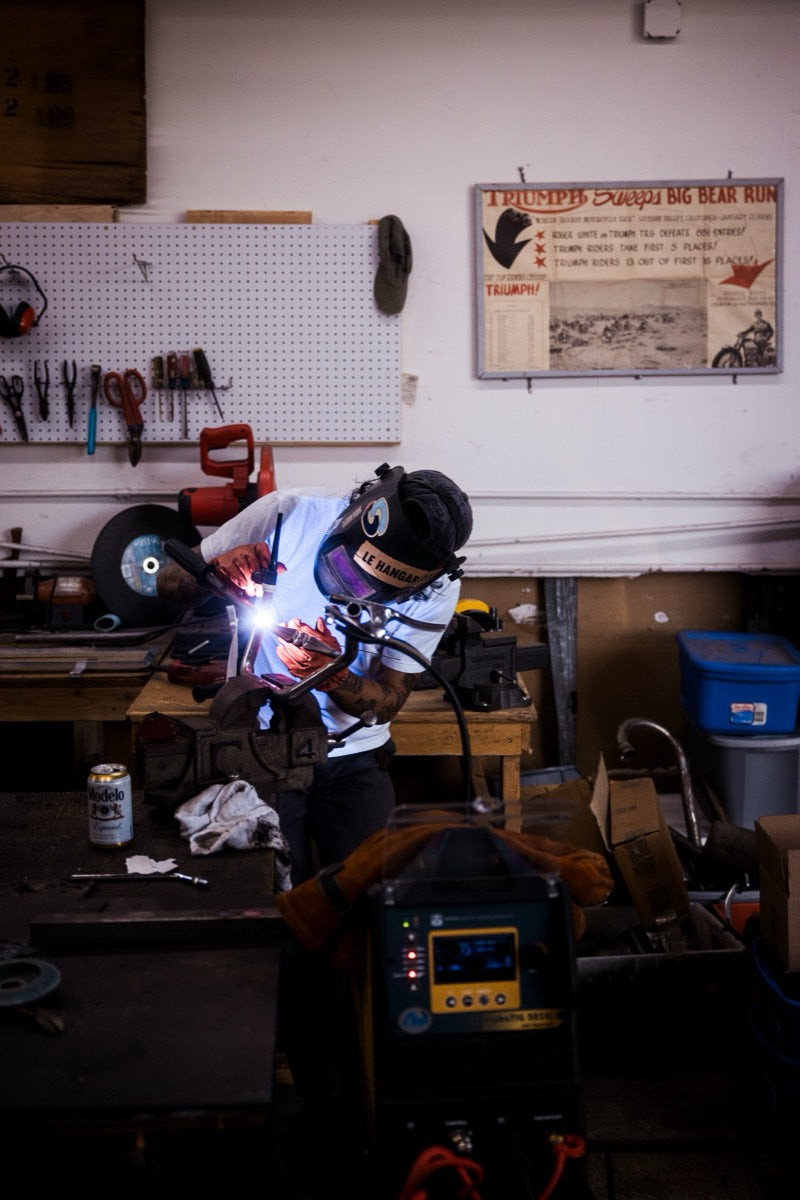Welding at the bench in Le Hangar 23 shop gear